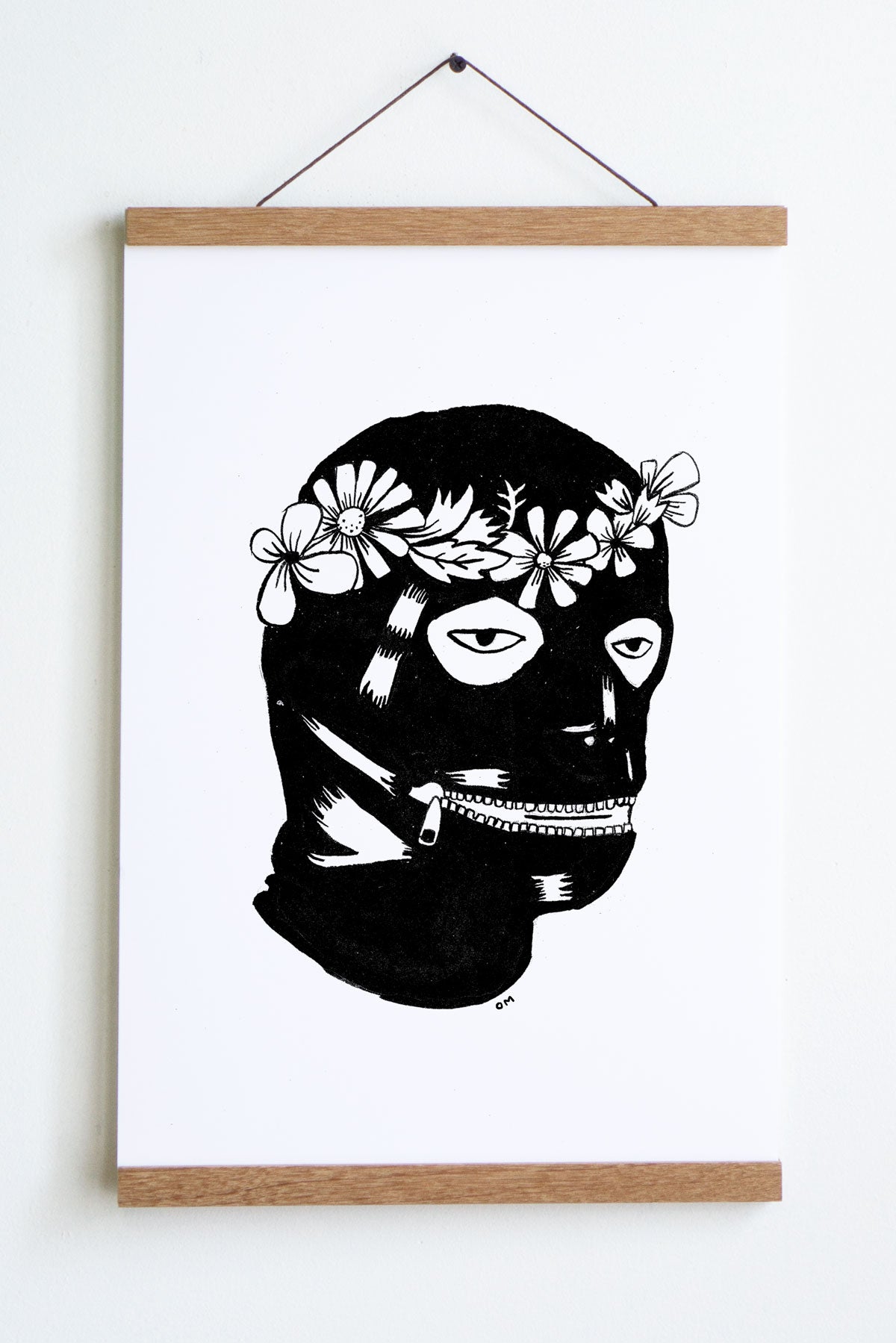 black and white drawing of head with leather covering with zipper mouth and flower crown