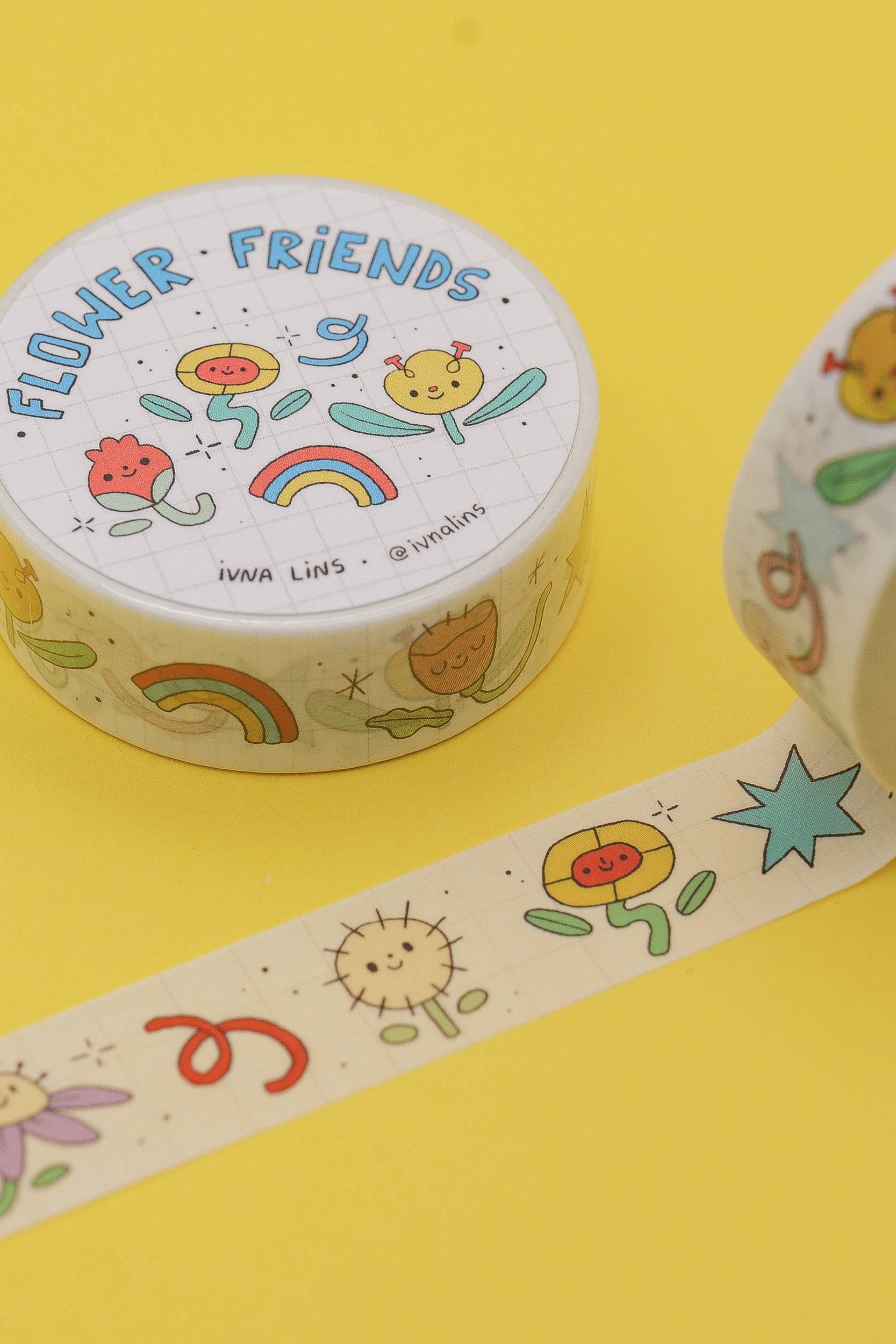 Decorative tape with cartoon designs on a yellow background