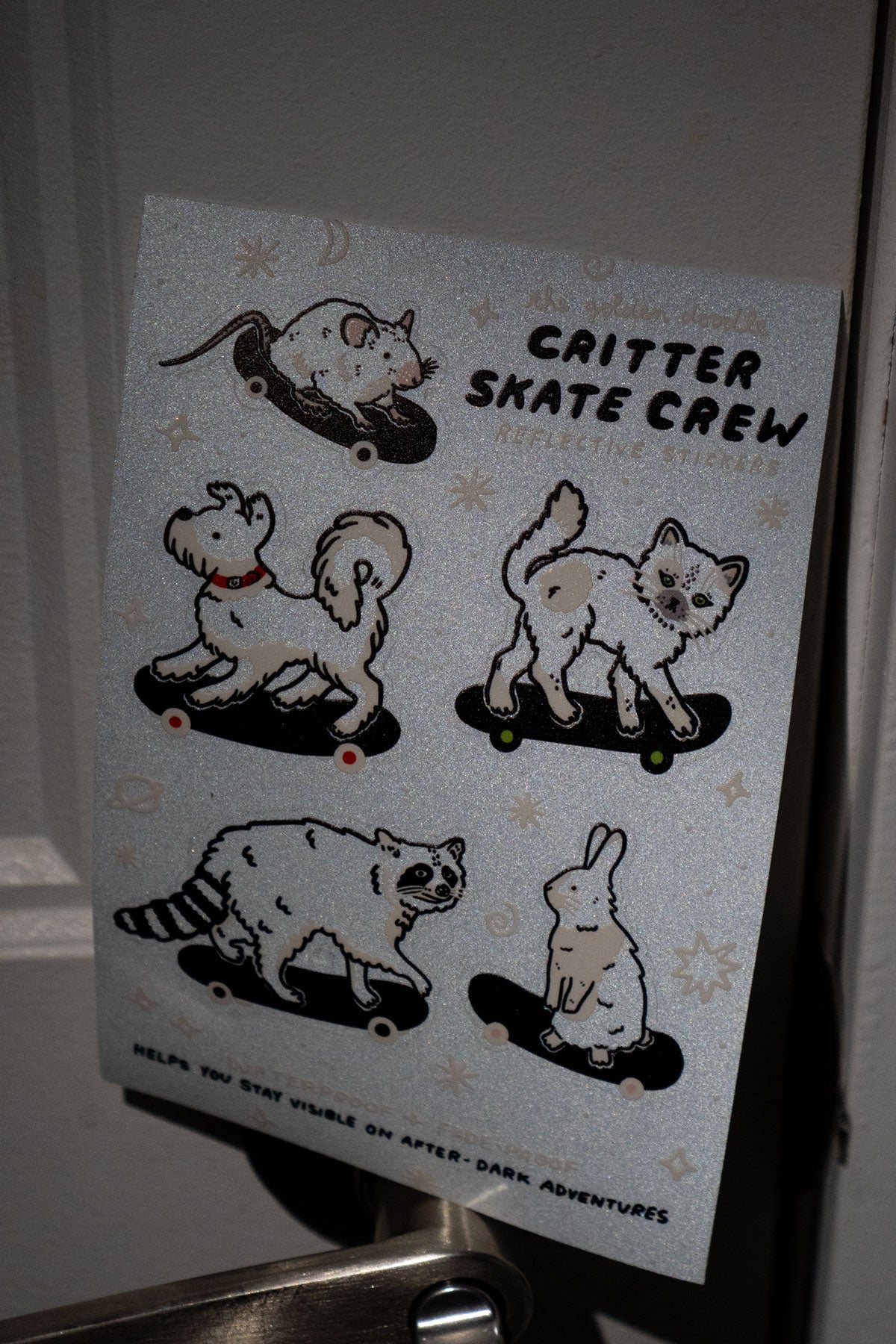 Reflective sheet of stickers shown sparkling in the dark