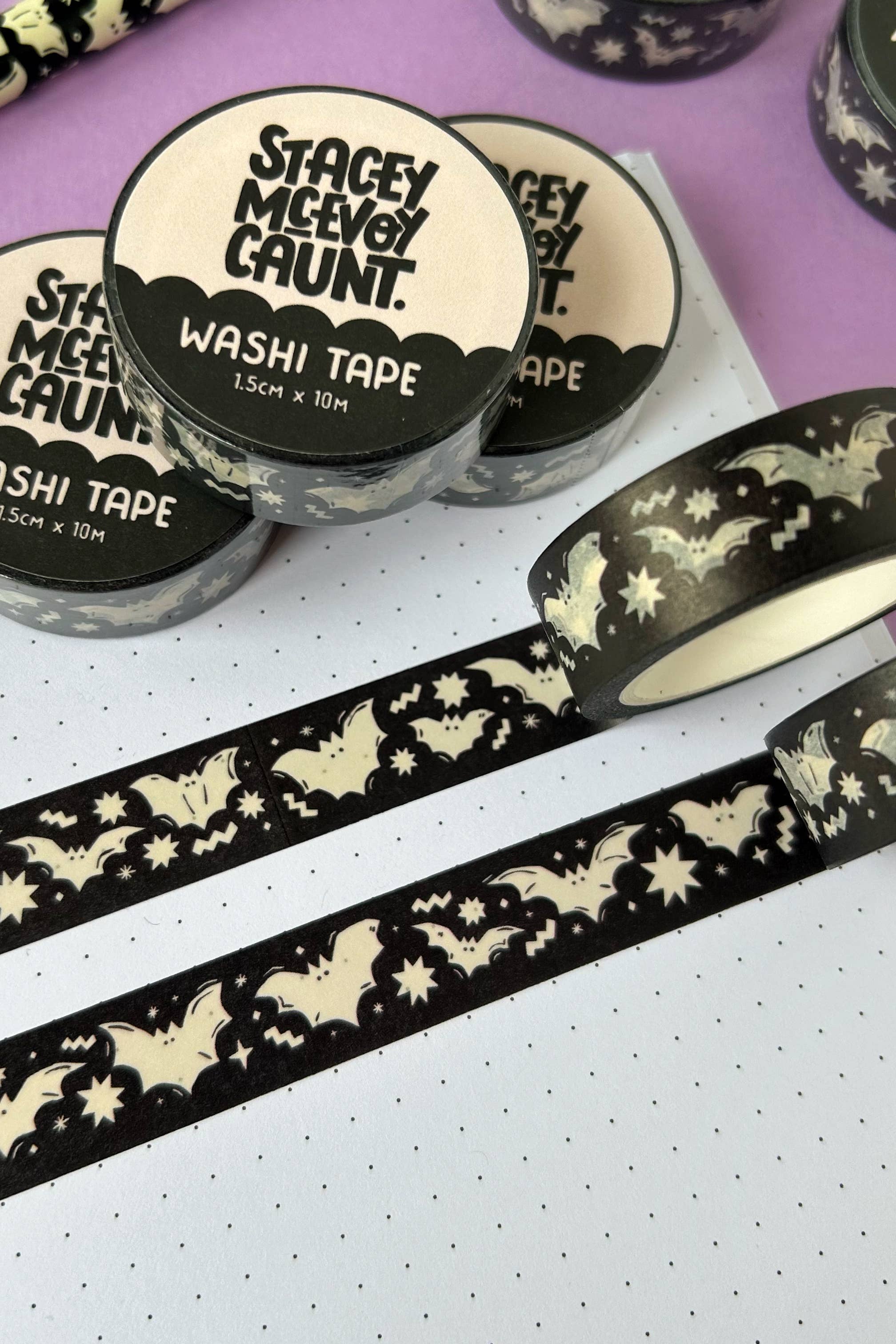 Washi tape with bat designs on a purple and white background