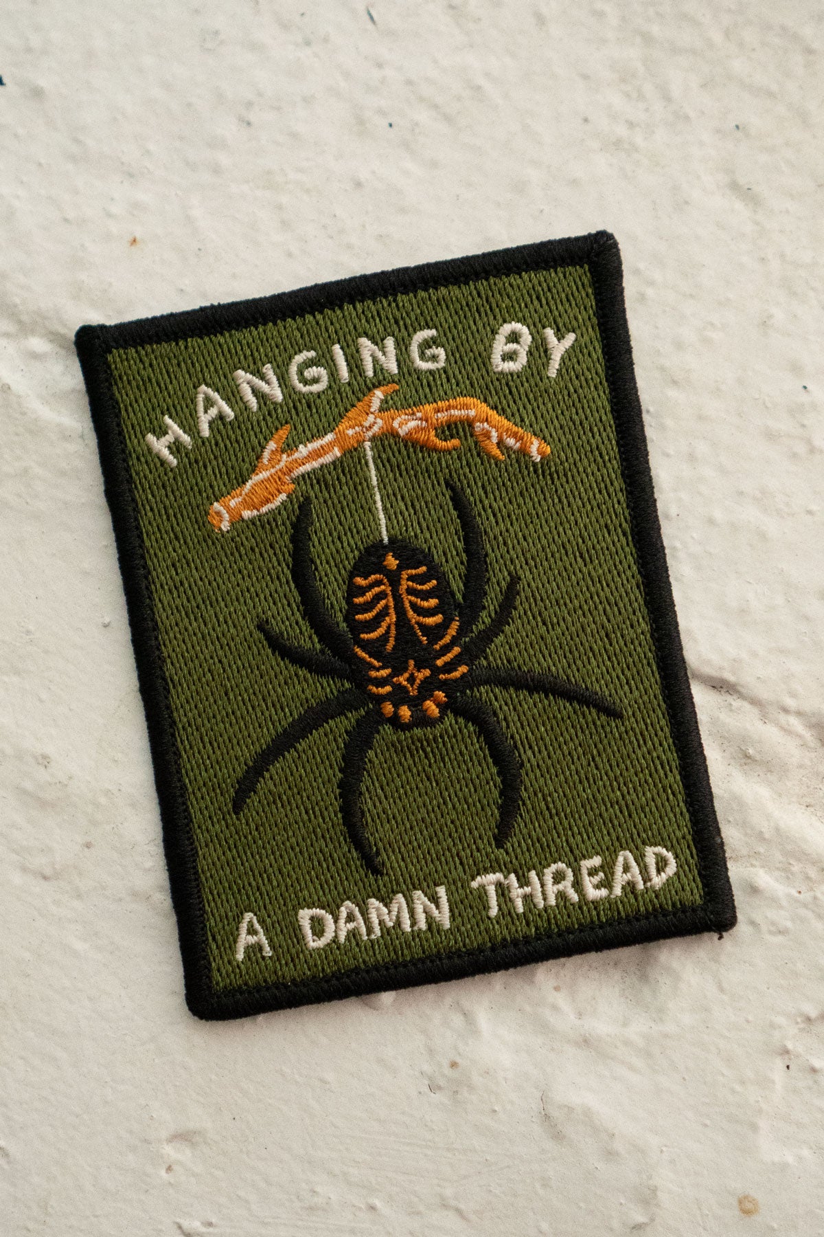 Patch Collant 'Hanging by a Thread'