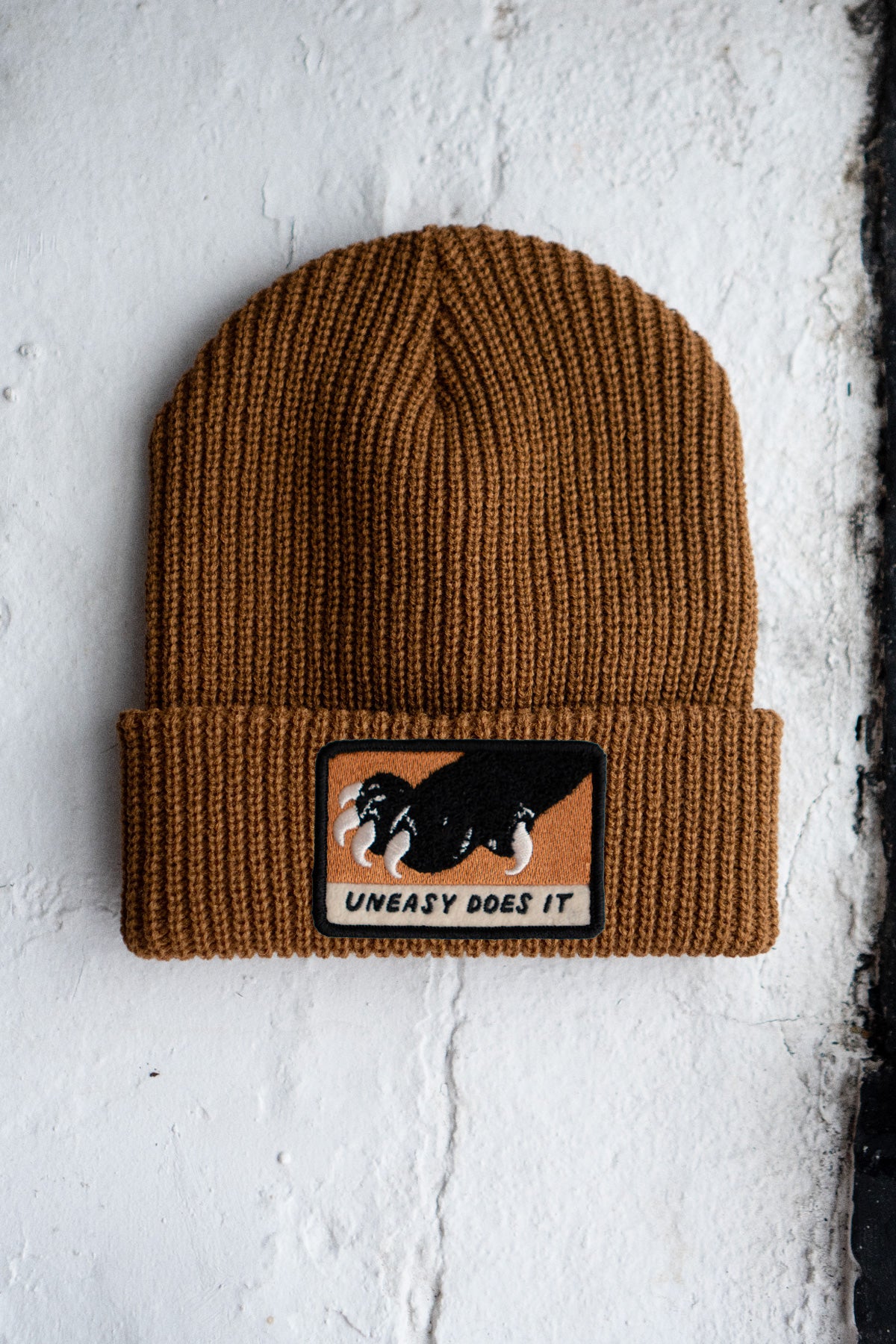 Uneasy Does It Patched Shaker Stitch Beanie
