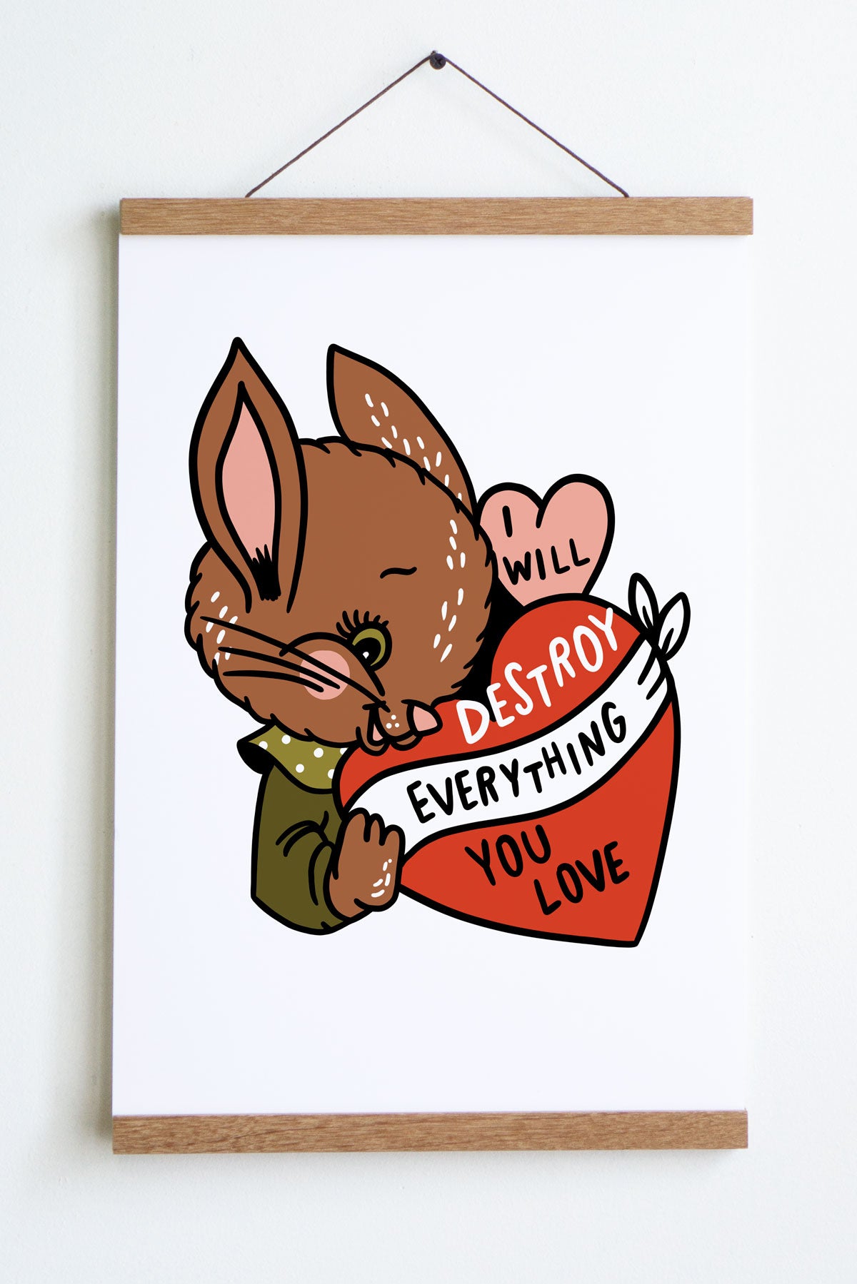 brown bunny with green shirt holding a pink and red heart with text that reads i will destroy everything you love inside hearts