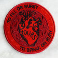 Round embroidered patch in shades of red featuring an anatomical heart and the Dashboard Confessional lyrics "to fill or burst - to break or bury"