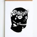 black and white drawing of head with leather  covering with zipper mouth and flower crown 