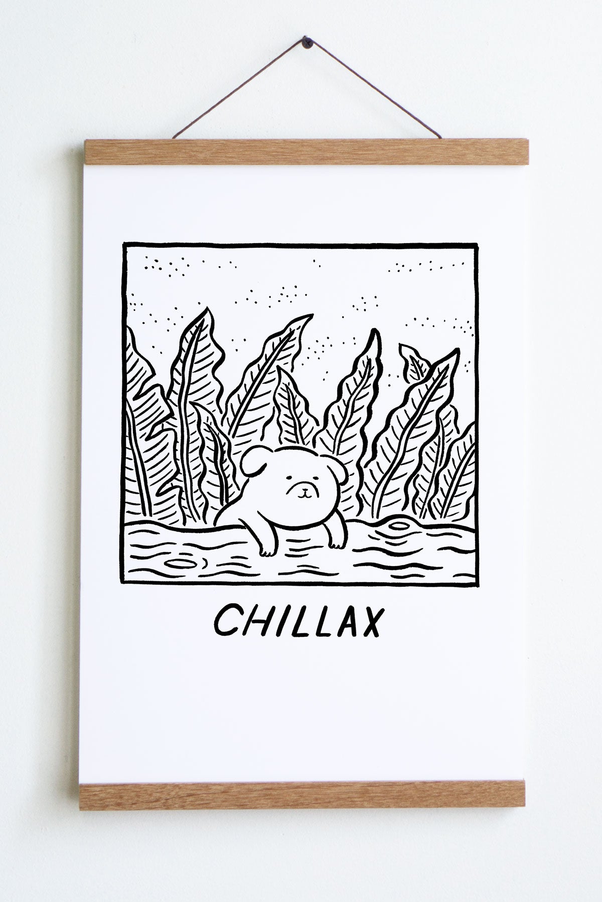 black linework on white paper drawing of dog leaning on log with leaves behind it with word chillax underneath 