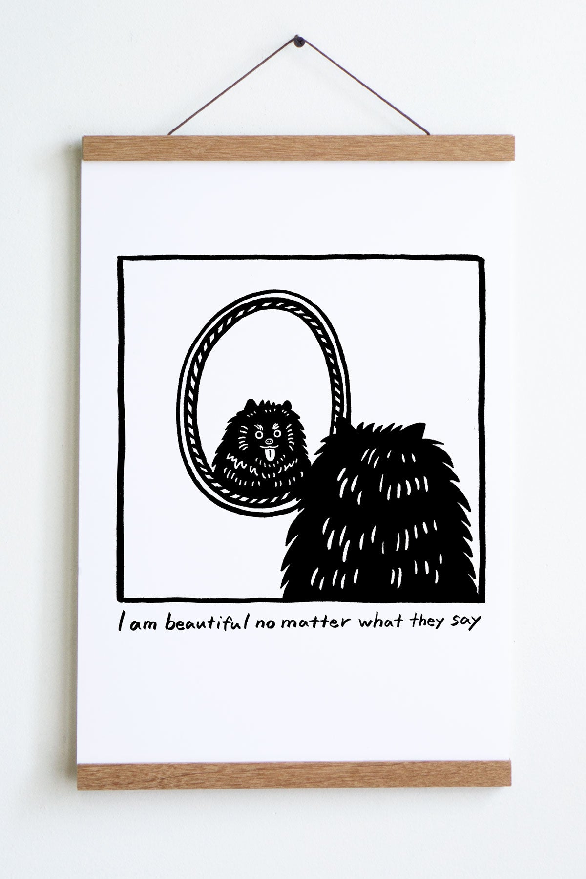 black line drawing in square of back of dogs head looking at reflection in oval mirror with tongue sticking out text underneath reads i am beautiful no matter what they say 